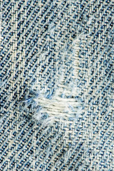 Dżinsy tkaniny, z otworem — Zdjęcie stockowe
