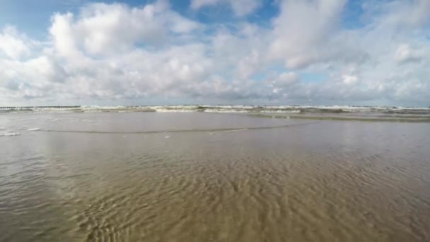 Surf of the Baltic Sea in Poland, camera in the surf — Stock Video