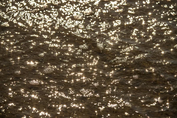 Acqua del mare con riflessi solari — Foto Stock