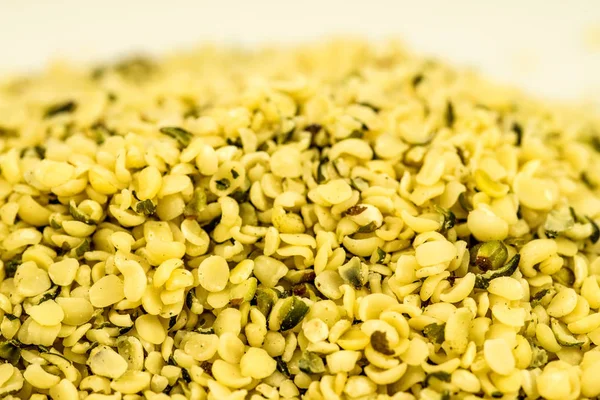 Hemp seeds, unpeeled in a closeup — Stock Photo, Image