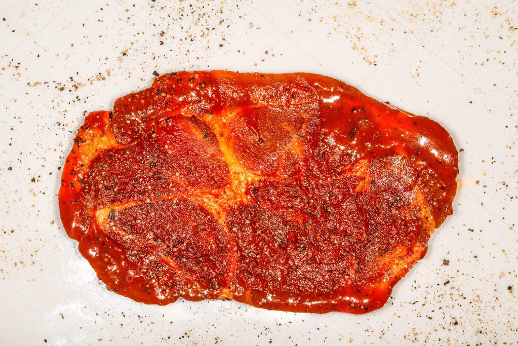 raw marinated pork neck with pepper