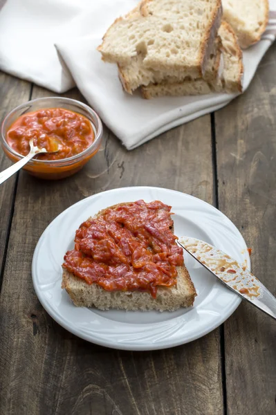 Slice of bread smeared with homemade chutney — Stock Photo, Image