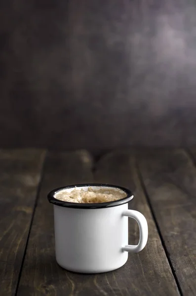 Coffee in vintage tin mug — Stock Photo, Image