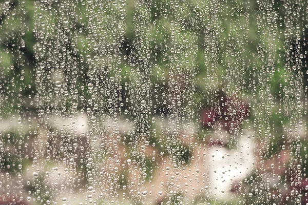 Raindrops on home window glass — Stock Photo, Image