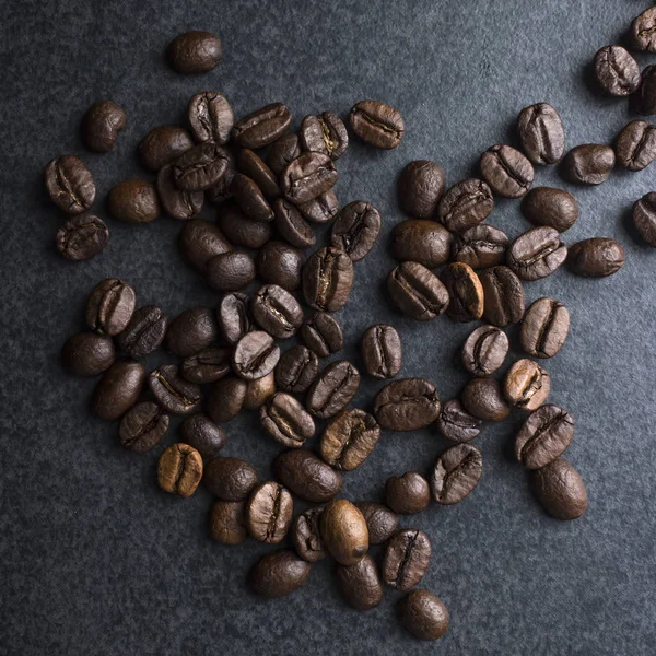 Close up de grãos de café torrados médios — Fotografia de Stock