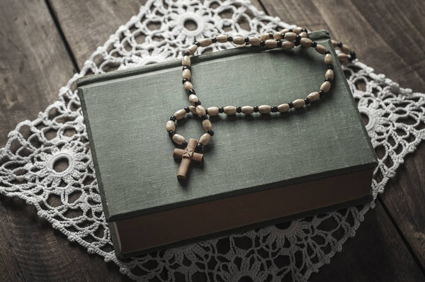 Ancient book and rosary