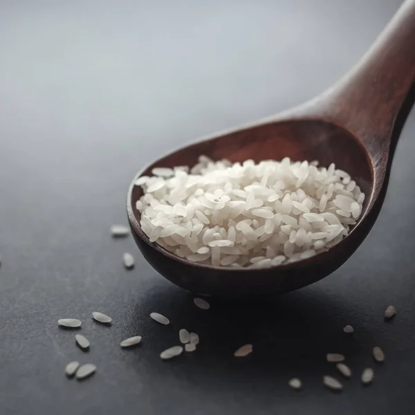 Wooden spoon with rice beans — Stock Photo, Image