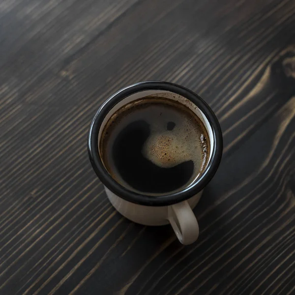 Overhead view of a freshly brewed mug of black coffee