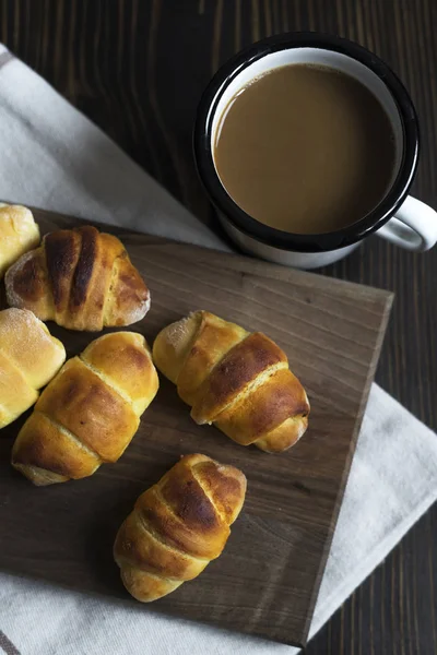 Mini croissants filled with cheese and coffee — Stock Photo, Image