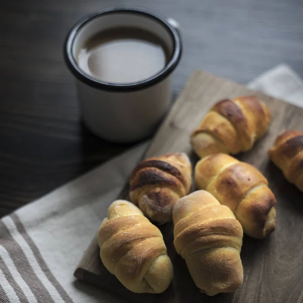 Mini croissants filled with cheese and coffee — Stock Photo, Image