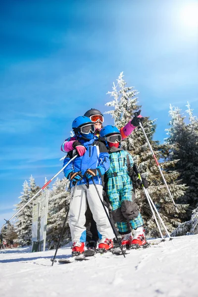 Happy family ski team fun on beautiful mountain — Stock Photo, Image