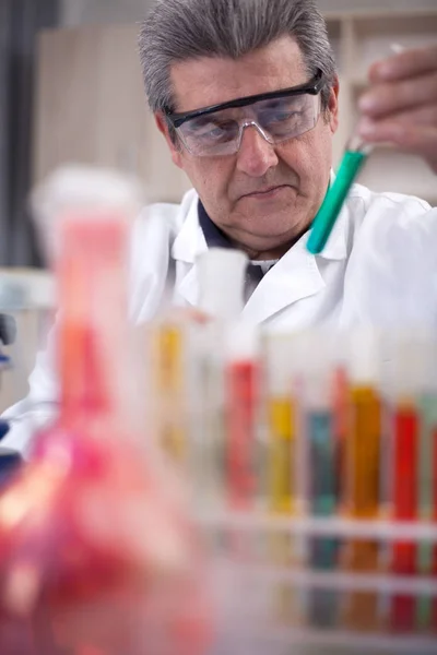 Senior scientist researching in laboratory — Stock Photo, Image