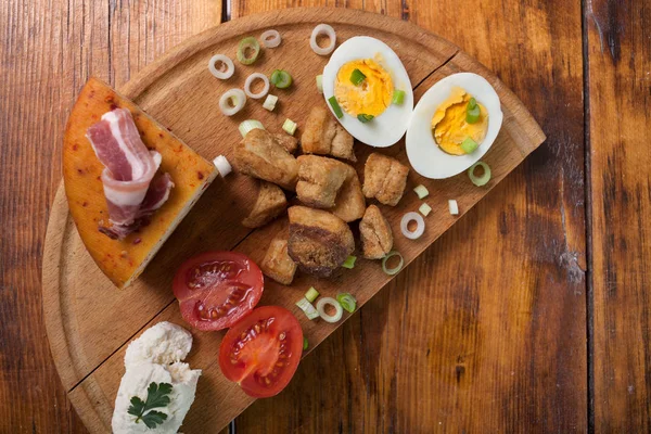 Pork greaves cheease and bacon on wooden background — Stock Photo, Image