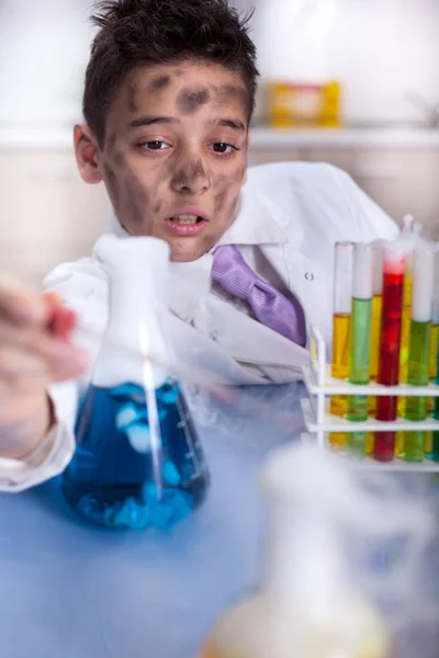 Yong funny scientist doing some crazy experiment — Stock Photo, Image