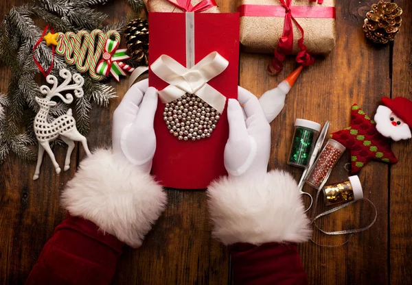 Santa's hands, make a wish list for Christmas night — Stock Photo, Image