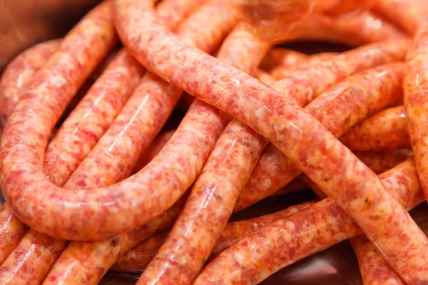 Close view of homemade raw thin sausages — Stock Photo, Image