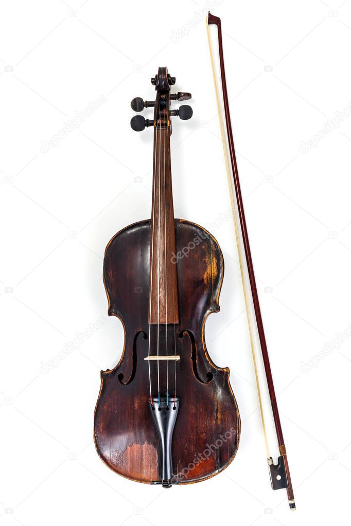 Old violin with bow on white background