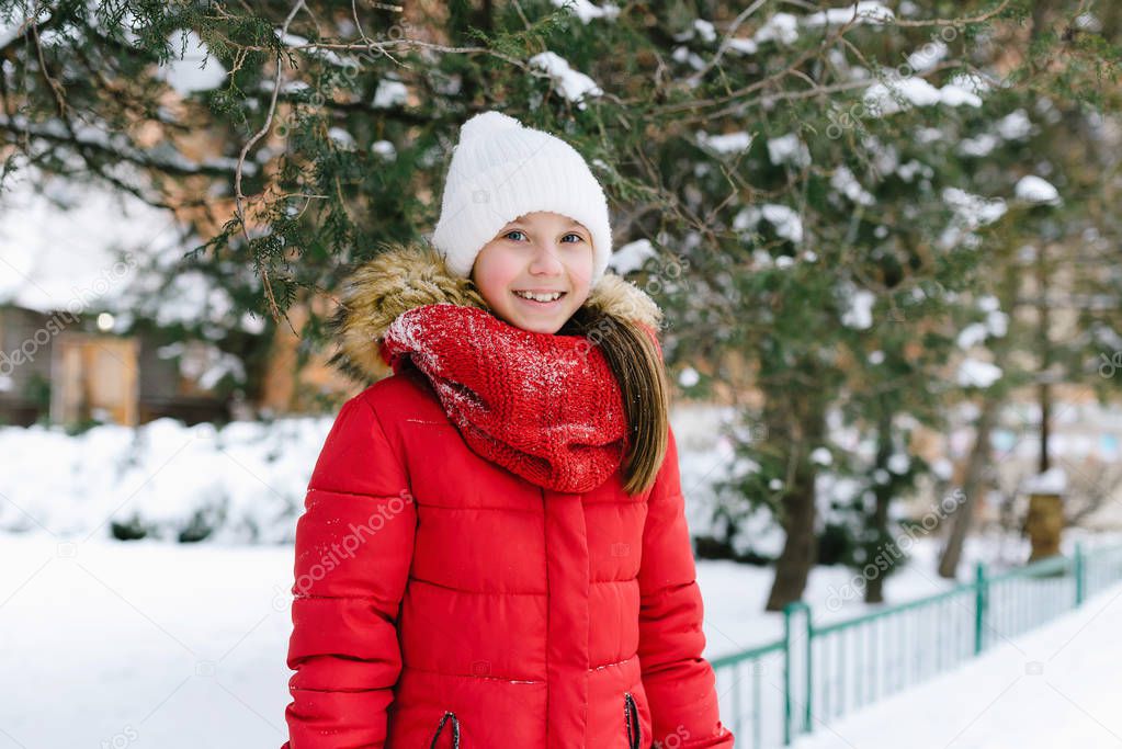 girl in a red jacket in winter