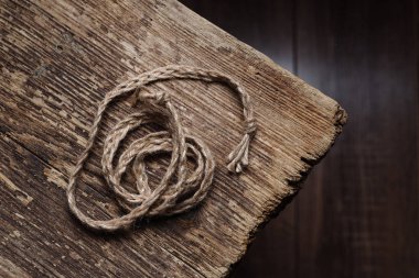 Rope on a wooden table clipart