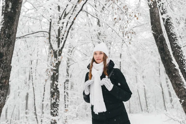 Beautiful young girl in a white winter forest — Stock Photo, Image