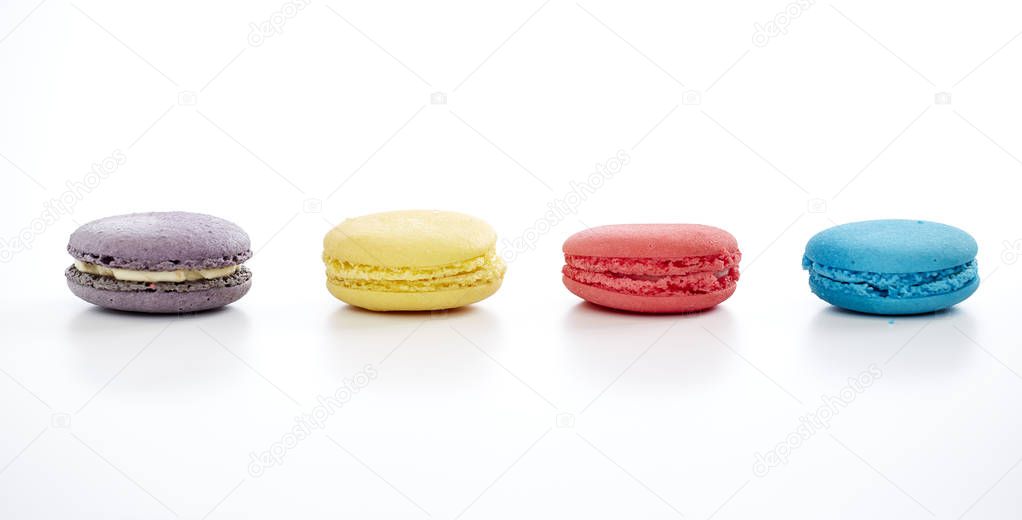macaron pastry, blue, pink, yellow, purple on white background