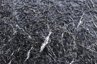 Doğal görünüyor bir yüzey üzerinde siyah mermer desen