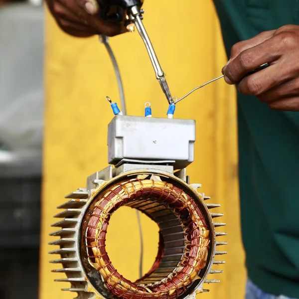 repairman during maintenance work of electric motors