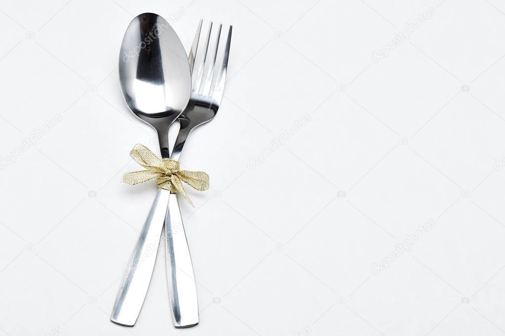 Fork and spoon with ribbon 