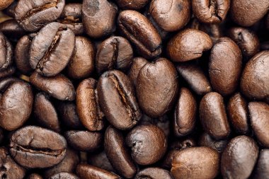 Kavrulmuş kahve çekirdekleri, arka plan olarak kullanılabilir.