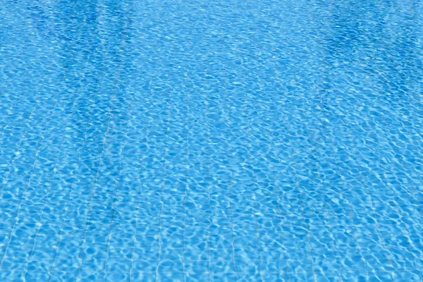 Sparkling blue pool surface on a sunny day