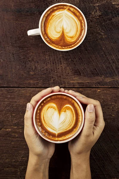 Female Hands Holding Cup Coffee Foam Wooden Table Top View — Stock Photo, Image
