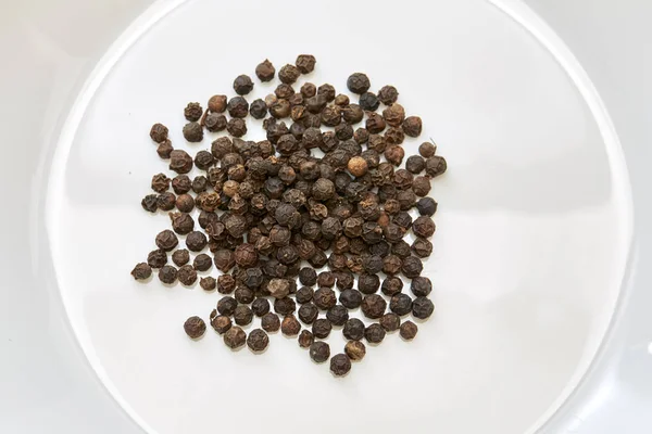 Black pepper was placed on a white background