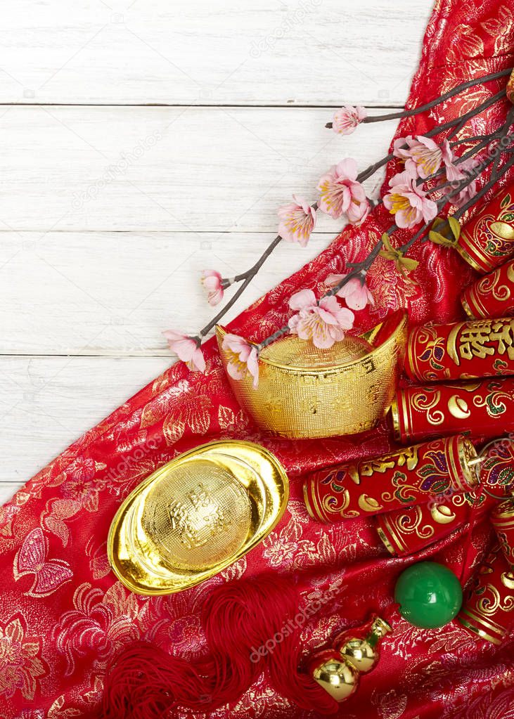 Chinese new year festival decorations , the chinese character on the gold ingots means fortune and luck
