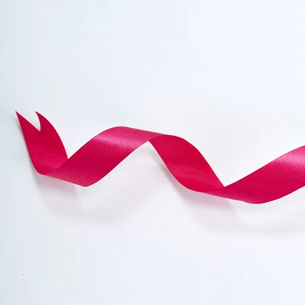 Pink ribbon on a white background — Stock Photo, Image