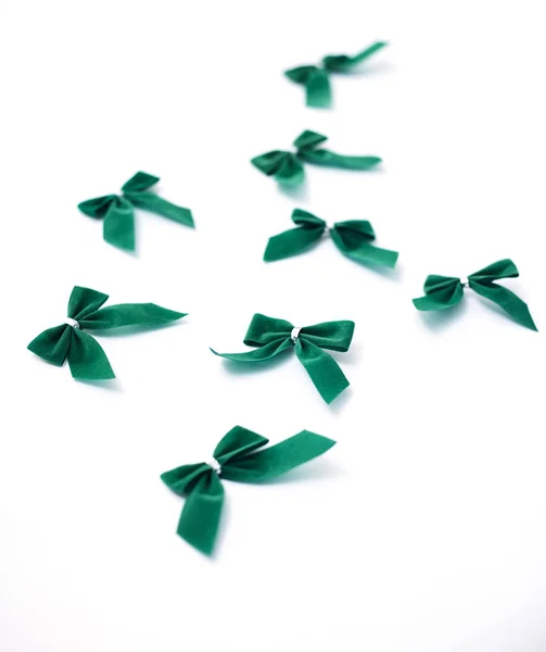 Green velvet bows on white — Stock Photo, Image