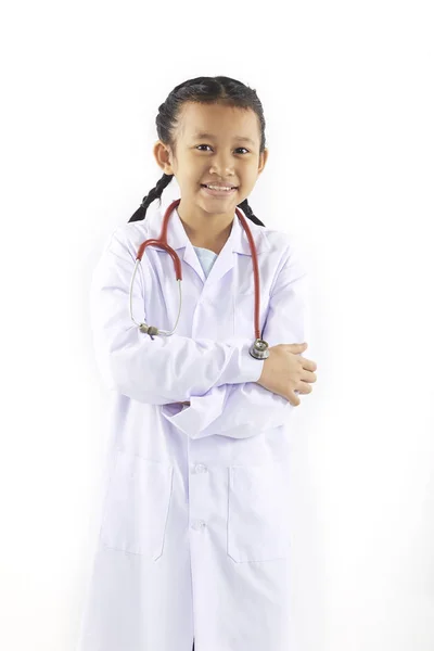 Liten flicka dröm i medicinsk kostym — Stockfoto