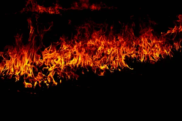 Fire flames on a black — Stock Photo, Image