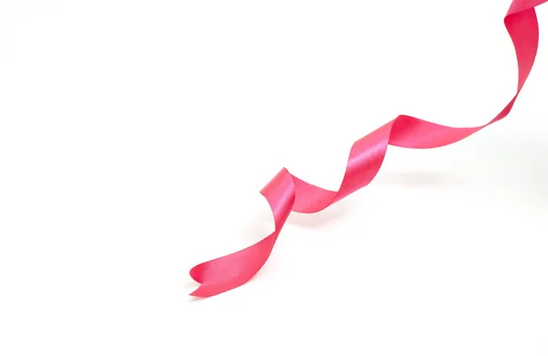 Pink curly ribbon on white — Stock Photo, Image