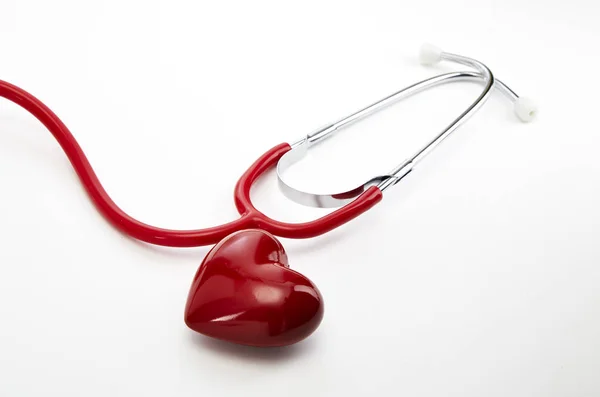 Red stethoscope with red heart — Stock Photo, Image