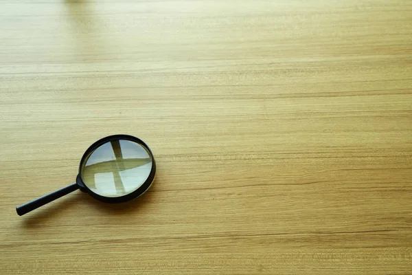 Magnifying glass over the table — Stock Photo, Image