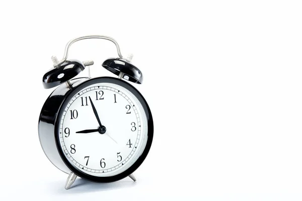 Relógio de alarme vintage preto no fundo branco — Fotografia de Stock