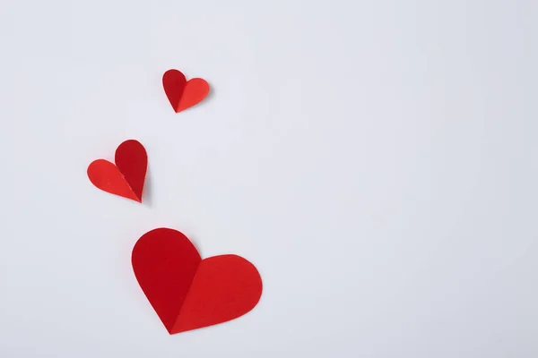 Red paper hearts on white background — Stock Photo, Image