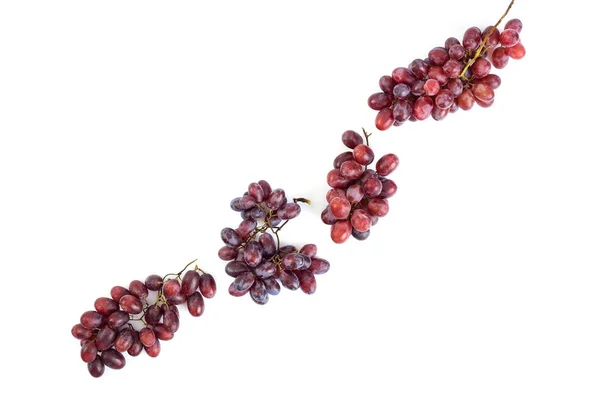 Куча свежего сочного винограда на белом — стоковое фото