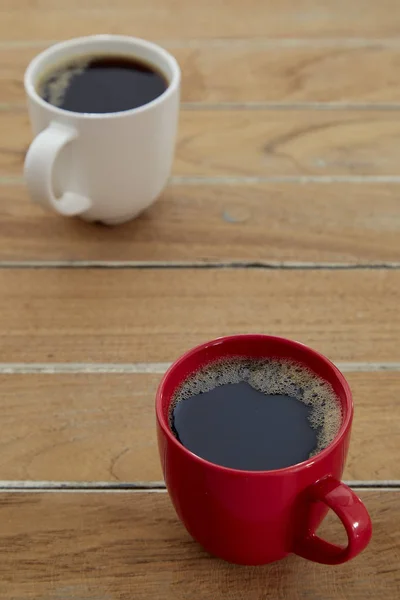 Two red and white mug coffee on wooden — Stock Photo, Image