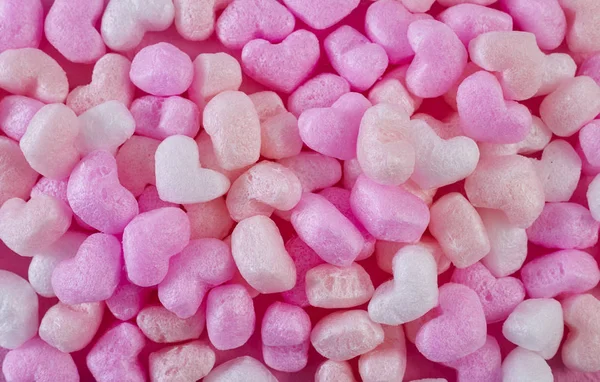 Rosa Schaumstoff Herzen rosa Papier Hintergrund — Stockfoto