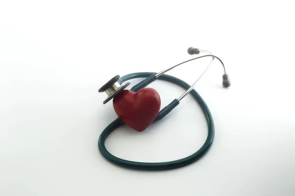 Red heart and a stethoscope on white — Stock Photo, Image