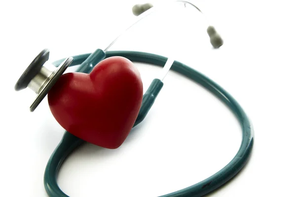 Red heart and a stethoscope on white — Stock Photo, Image