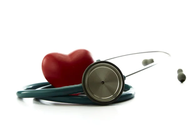Red heart and a stethoscope on white — Stock Photo, Image