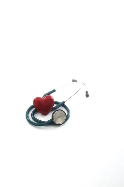 Red heart and a stethoscope on white — Stock Photo, Image