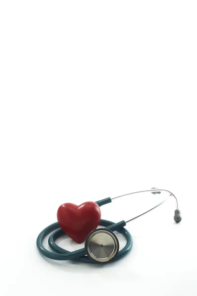 Red heart and a stethoscope on white — Stock Photo, Image